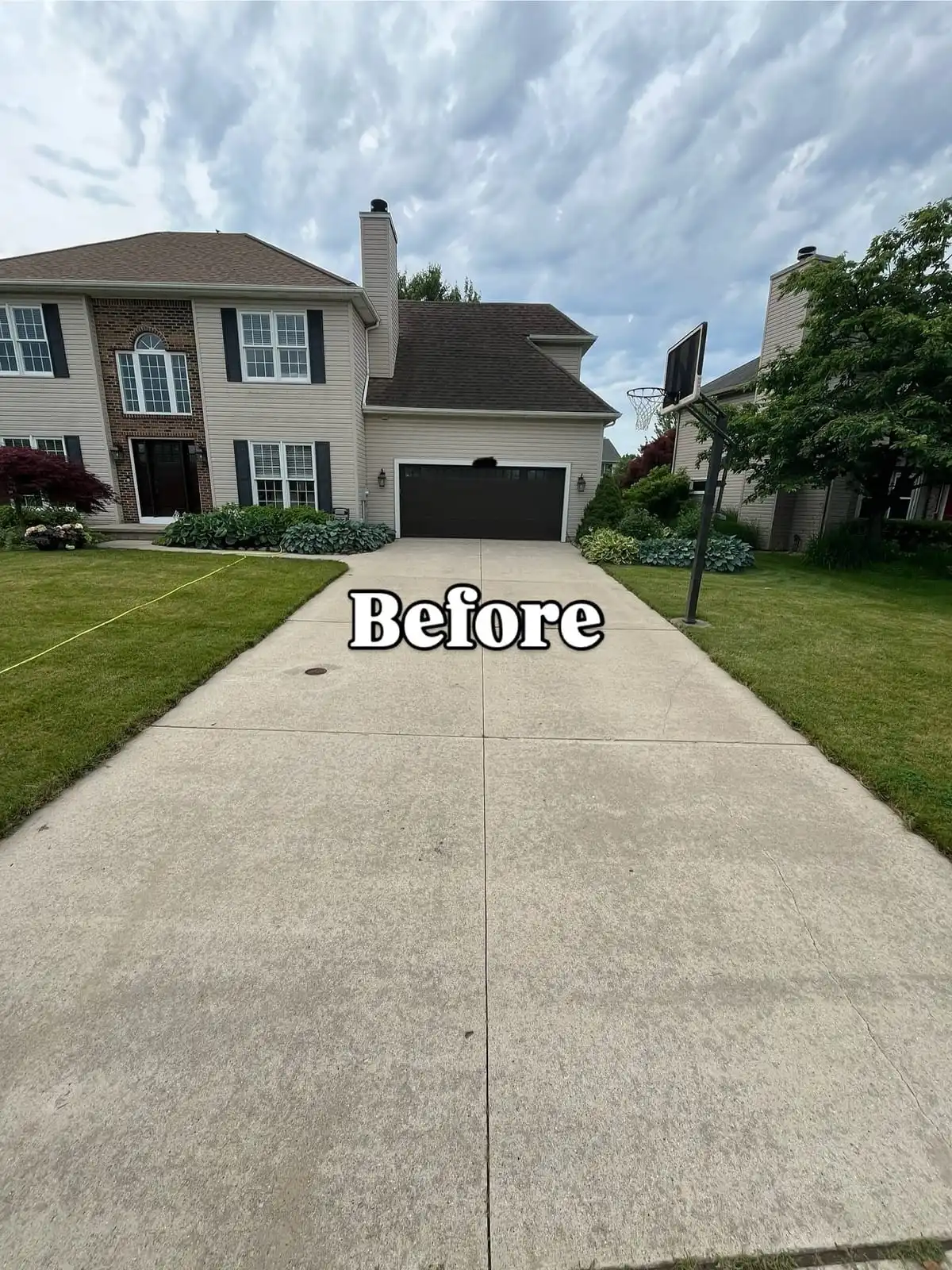 Dirty driveway before pressure washing in Saline MI